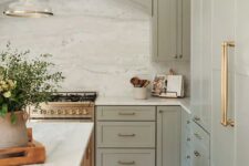 a cozy pastel green kitchen design