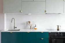 a teal and mint modern kitchen with a white backsplash and copper touches looks bold and chic
