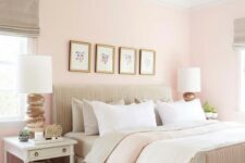 a welcoming eclectic bedroom with light pink walls, neutral textiles and upholstery, a woven lamp and white nightstands