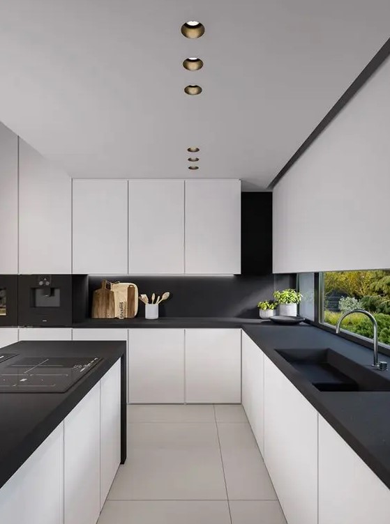 an ultra-minimalist black and white kitchen with sleek matte cabinets and black countertops and a backsplash is jaw-dropping