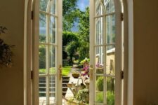 arched white French doors will be a great solution for a garden entrance, they will add chic and elegance to both indoor and outdoor spaces