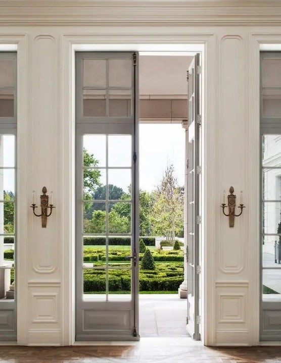 beautiful and delicate grey French doors to the garden and matching windows look amazingly chic and bring much natural light inside
