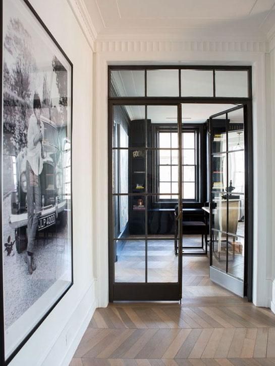 beautiful black French metal frame doors perfectly match the style and add chic and a refined touch to the space