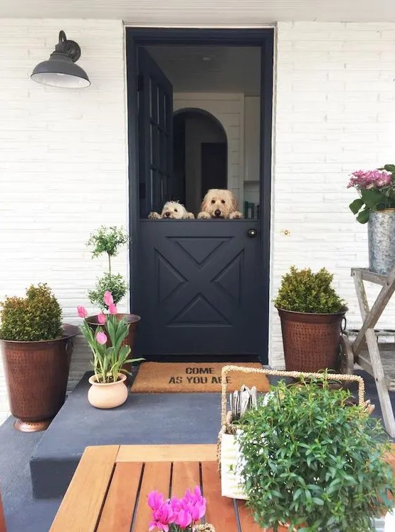 keep your pets at home while having breezes and fresh air inside with a comfy Dutch door, like here, a black Dutch door