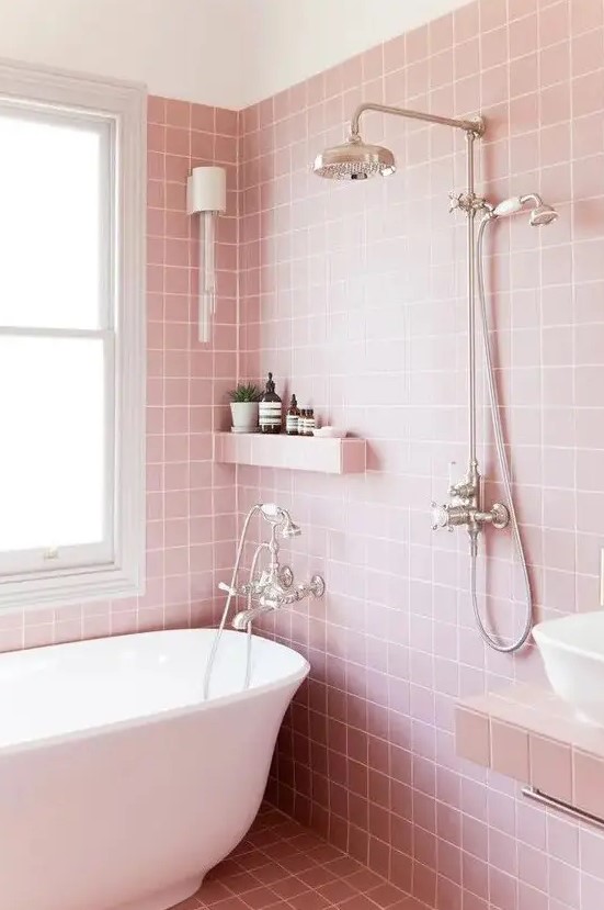 light pink bathroom tiles on the walls and floor plus white create a modern girlish feel