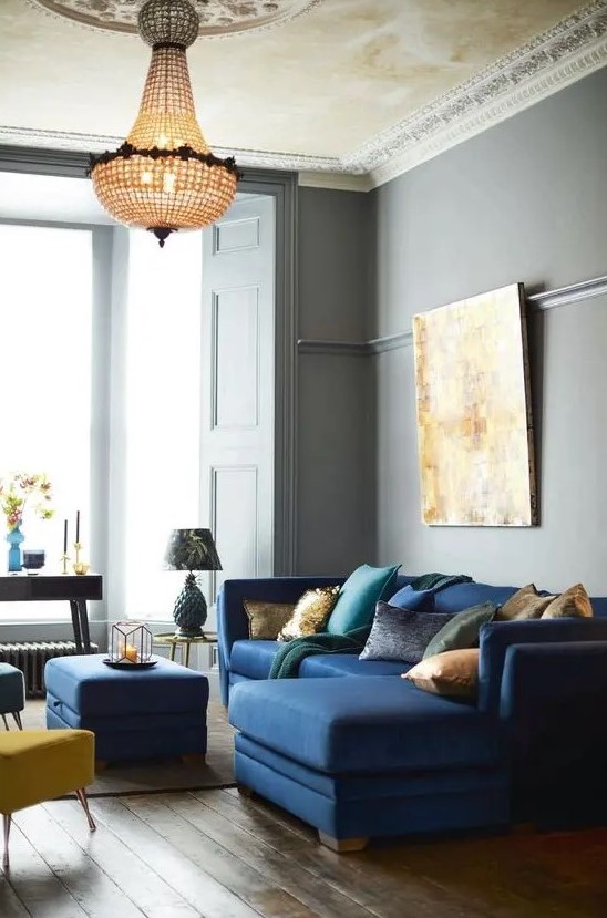 a lovely grey living room with yellow touches