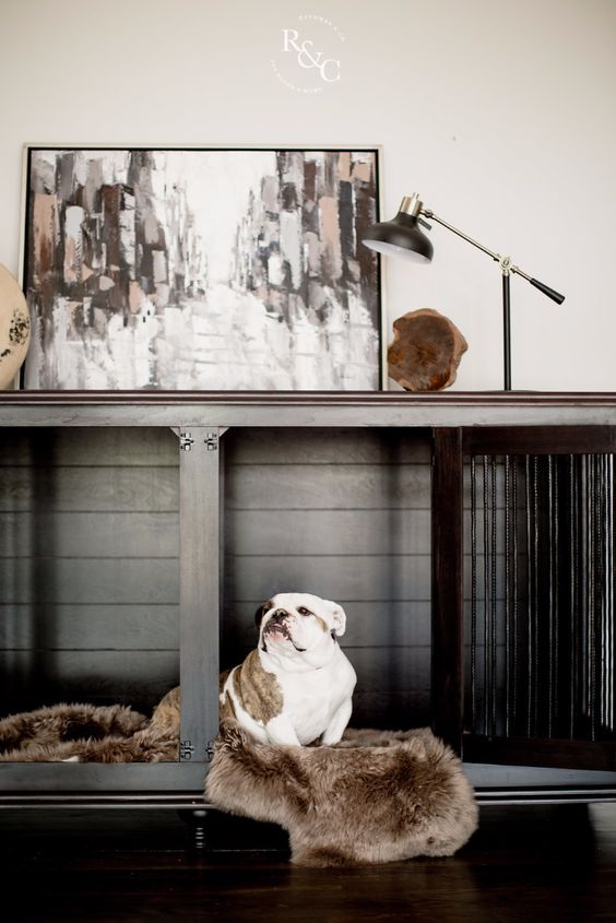 a chic graphite grey console table with a built-in dog crate with faux fur is a stylish idea for a modern space