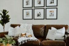 a cozy living room with a grid gallery wall