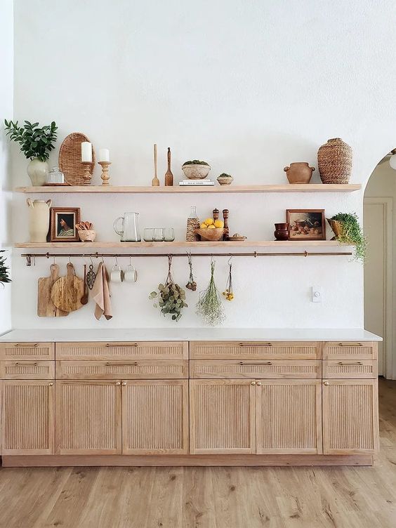 a cozy kitchen with fluted cabinets