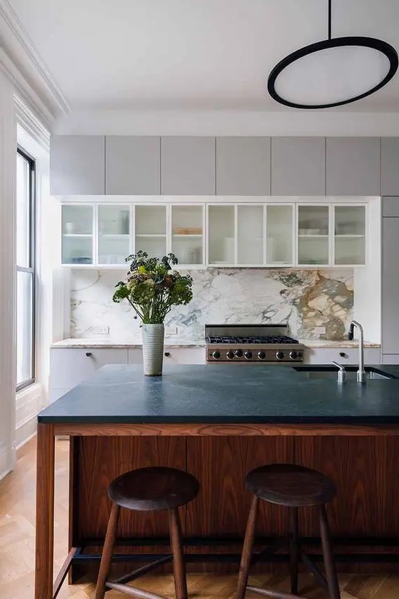 a stylish kitchen island with a black countertop