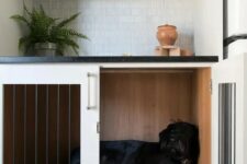 a kitchen nook with a lower cabinet turned into a dog crate is a cool and very functional idea for your home
