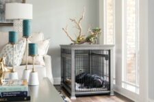 a large dog kennel with some decor on top is a great addition to a farmhouse space, it matches the interior