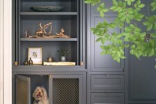 a modern farmhouse kitchen in graphite grey with a cabinet turned into a dog crate and a drawer with the dog’s bowls