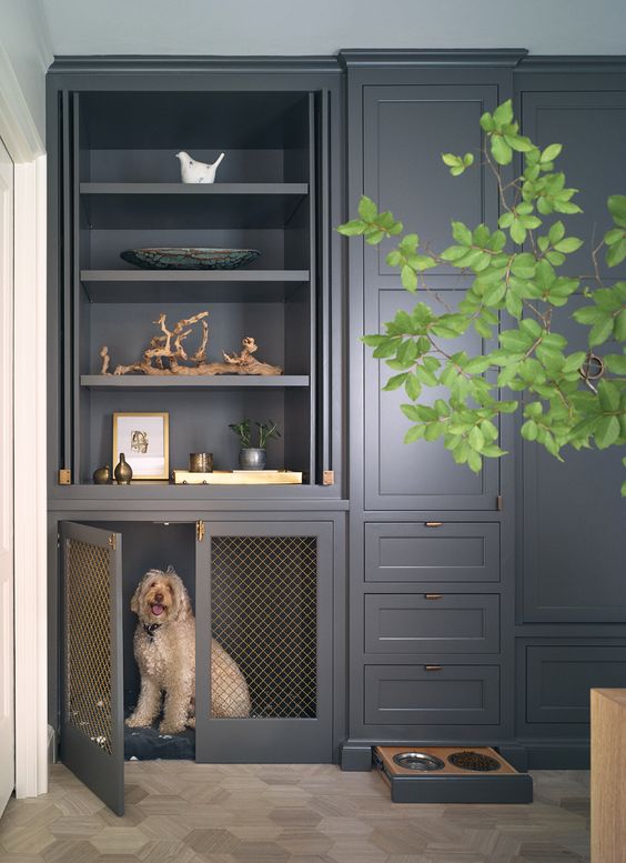 a modern farmhouse kitchen in graphite grey with a cabinet turned into a dog crate and a drawer with the dog's bowls