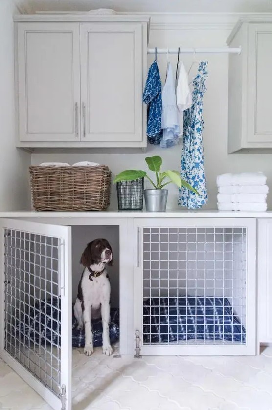 a neutral laudnry room with a lower cabinet turned into a dog crate with bold blue printed mattresses is a cool idea