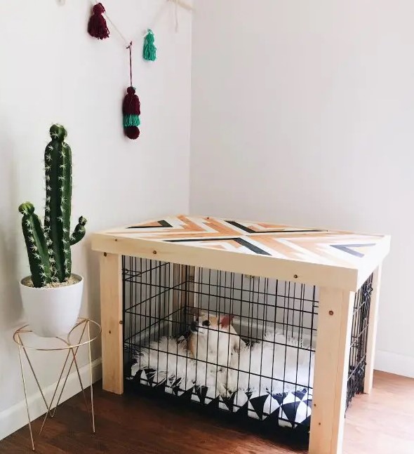 a pretty mid century modern dog kennel with a geometric pattern on top and a geo printed mattress