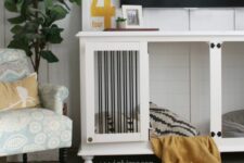 a shared white dog kennel as a TV console is a cool idea for a modern farmhouse living room