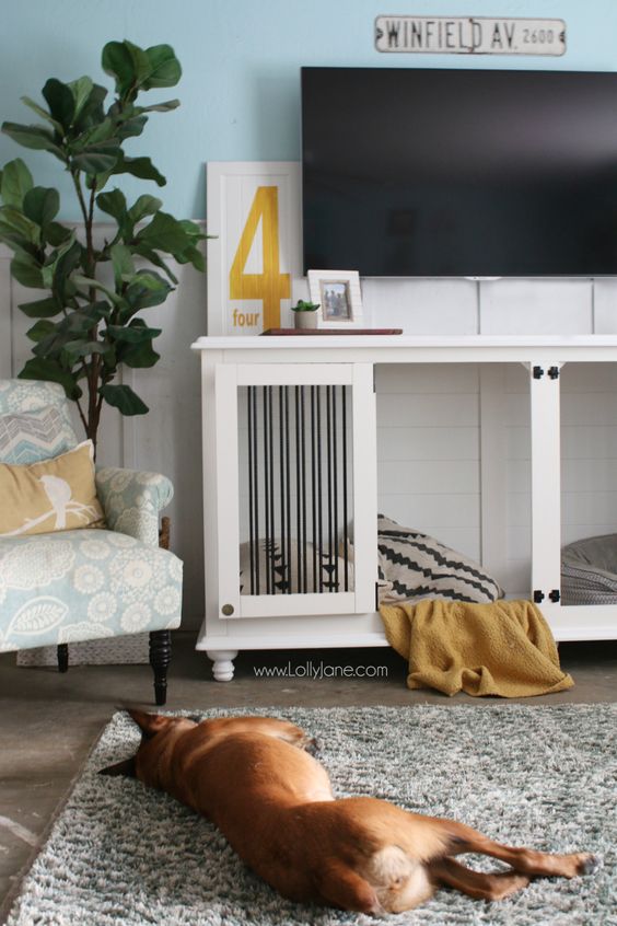 a shared white dog kennel as a TV console is a cool idea for a modern farmhouse living room