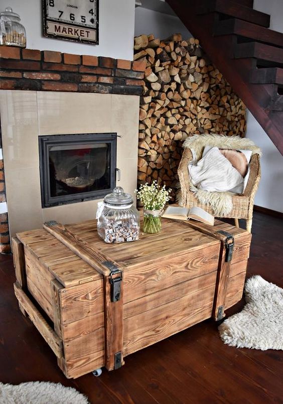 a stained vintage chest as a coffee table in the rustic space, it looks very rustic and farmhouse like