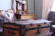 a vintage stained chest with an open storage compartment, with a basket and books is a stylish and catchy idea for a farmhouse space