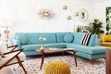 a welcoming mid-century modern living room with a modern turquoise sofa, elegant mid-century modern furniture and touches of gold for chic