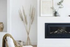 a cute white Scandi living room with a fireplace