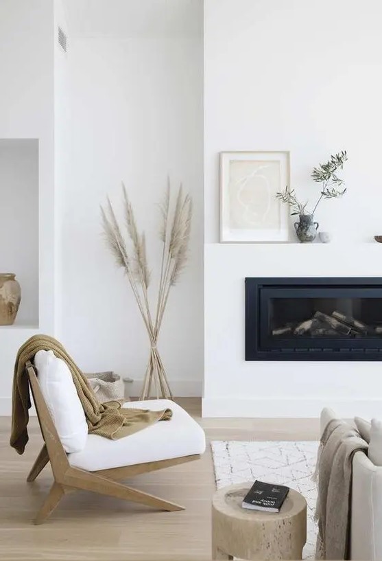 a cute white Scandi living room with a fireplace