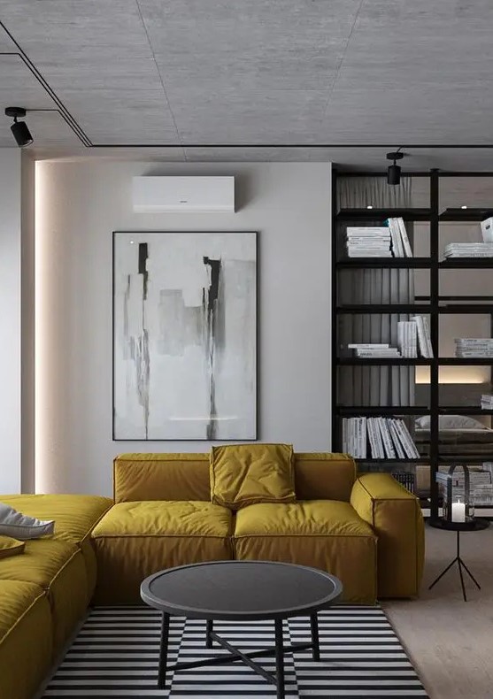 a yellow L shaped sectional sofa adds color to this monochrome space and makes it shine