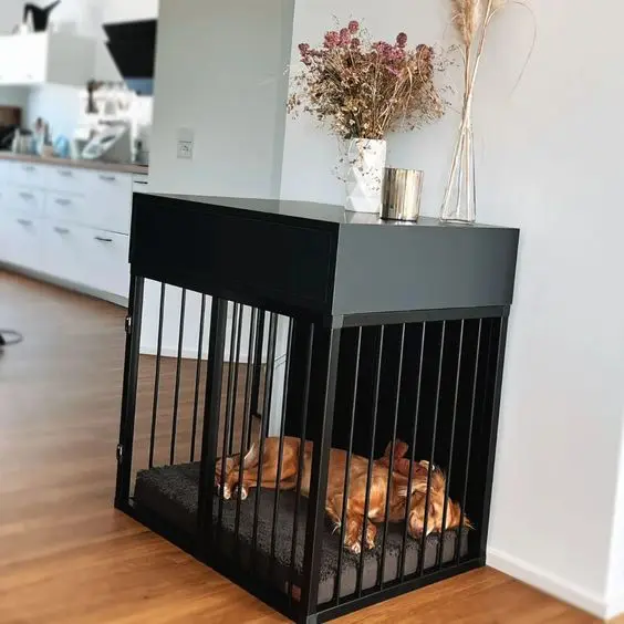 an elegant black console table with a built-in dog crate and a pillow inside is a minimalist and stylish solution for an wakward nook