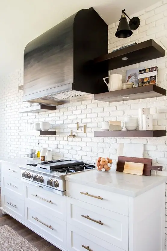 a chic farmhouse kitchen with a white brick statement wall that also acts as a kitchen backsplash