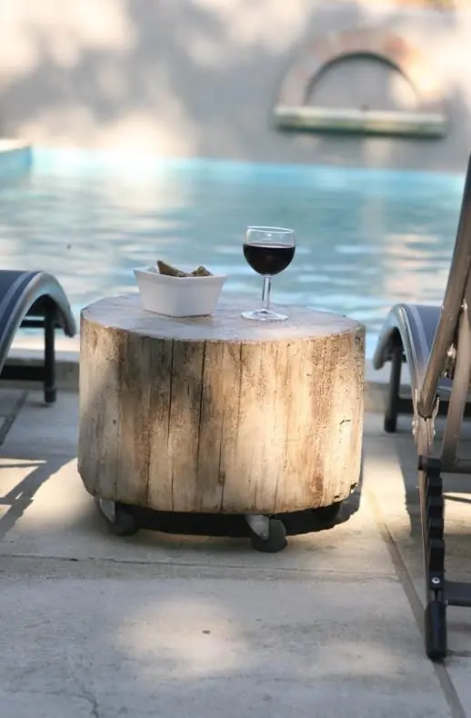a tree stump on casters can become a nice side table or stool, and can be used in many outdoor locations giving thme a rustic feel