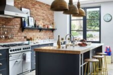 07 a Victorian meets rustic kitchen with graphite grey cabinets, red bricks and metal pendant lamps