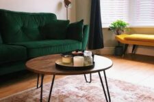 07 a cool mid-century modern coffee table with a rich stained round tabletop and hairpin legs is pure elegance and timeless style for your living room