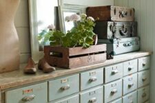 09 a shabby chic mint colored apothecary cabinet will provide a lot of storag espace for a soft pastel interior in rustic and vintage style