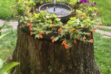 09 a tree stump with bright blooms and a small fountain on top is a catchy and fun idea for your garden, you can DIY it