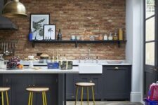 a stylish eclectic kitchen design with a brick backsplash