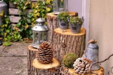 10 outdoor decor with tree stumps and large pinecones, candle lanterns and buckets with moss and berries is a cool and cozy idea