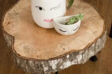 13 a lovely side table of a tree slice and black hairpin legs is a cool rustic piece that you can make yourself