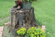 planters made of a tress tump and old boots