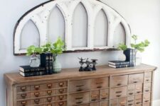 20 a vintage wooden apothecary cabinet as a gorgeous console table that will bring a rustic and vintage feel to the space