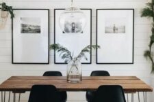 22 a Scandinavian dining room with a hairpin leg dining table, stylish black chairs, a gallery wall and some greenery around