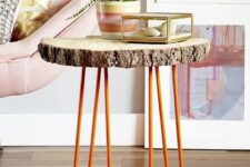 23 a side table of a tree slice and orange hairpin legs is a cool decor piece for a living room in mid-century modern style
