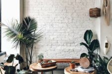 28 a white brick wall adds texture to this cozy boho chic nook and makes a nice backdrop for greenery and stained furniture