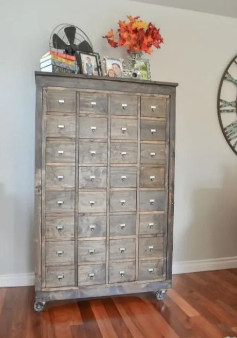 a reclaimed wood apothecary cabinet on casters will be a comfy storage unit for any space