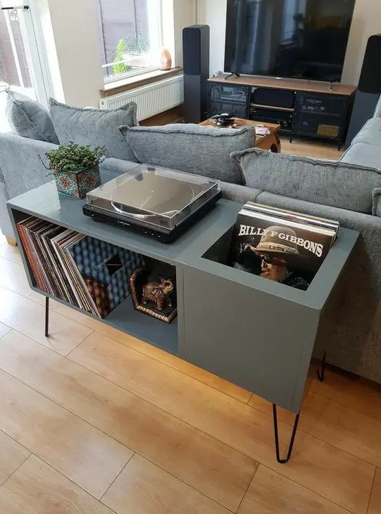 a graphite grey music console with plenty of storage and black hairpin legs is a chic and stylish idea for a living room