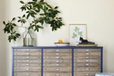 32 a renovated navy file cabinet with some lovely decor is a cool way to upcycle a piece and make your space cooler