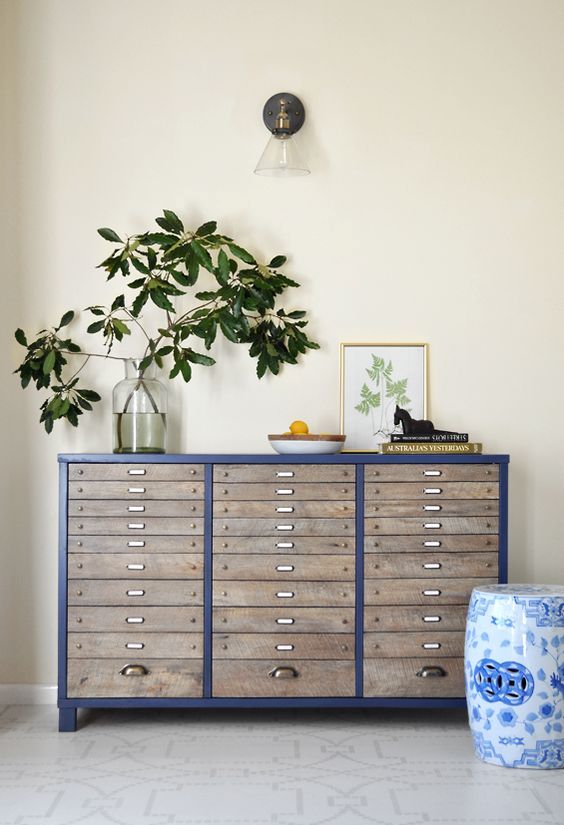 a renovated navy file cabinet with some lovely decor is a cool way to upcycle a piece and make your space cooler