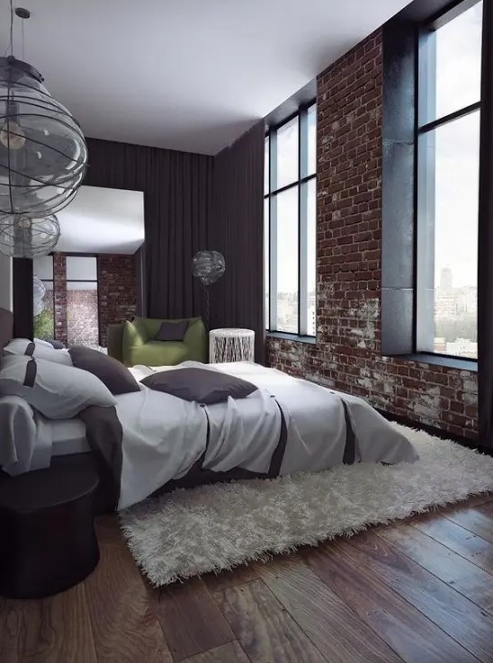 a contemporary bedroom is spruced up with a fake red brick wall that makes it less polished and more interesting