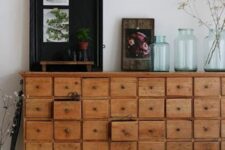 34 a stained card cabinet with some decor and jars is a chic and cool storage unit that will bring character to the space