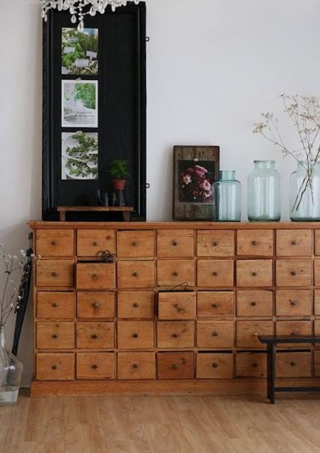 a stained card cabinet with some decor and jars is a chic and cool storage unit that will bring character to the space
